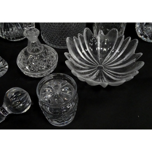 124 - A quantity of assorted glassware and cut crystal to include decanters, bowls, vase, etc. Largest dec... 