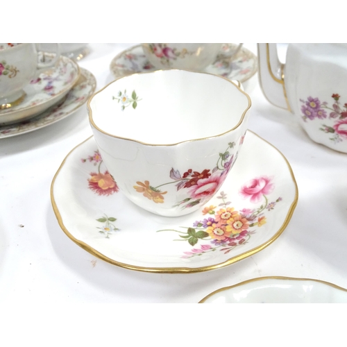 277 - A quantity of assorted tea / coffee wares to include cups and saucers, trios, cake / sandwich plates... 