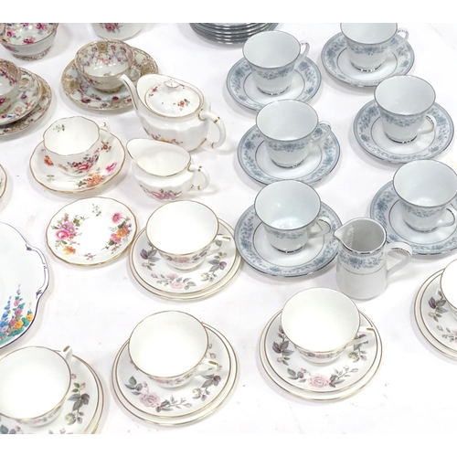 277 - A quantity of assorted tea / coffee wares to include cups and saucers, trios, cake / sandwich plates... 