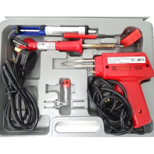 394 - A cased soldering iron tool set, together with a cased rotary sanding / polishing / engraving tool s... 