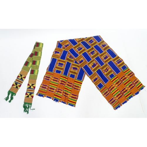 408 - Two African fabrics / textiles comprising a scarf and a shawl / wrap, the largest approx 73