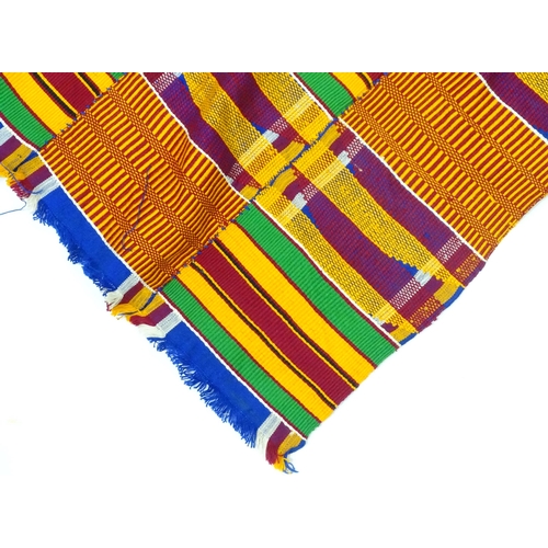 408 - Two African fabrics / textiles comprising a scarf and a shawl / wrap, the largest approx 73