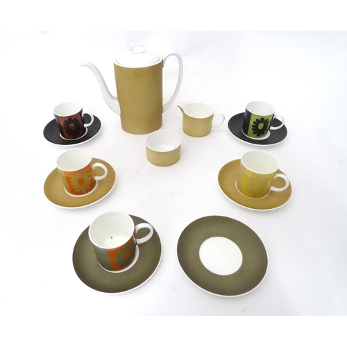 410 - A quantity of assorted Susie Cooper coffee wares to include the Carnaby Daisy pattern, comprising te... 