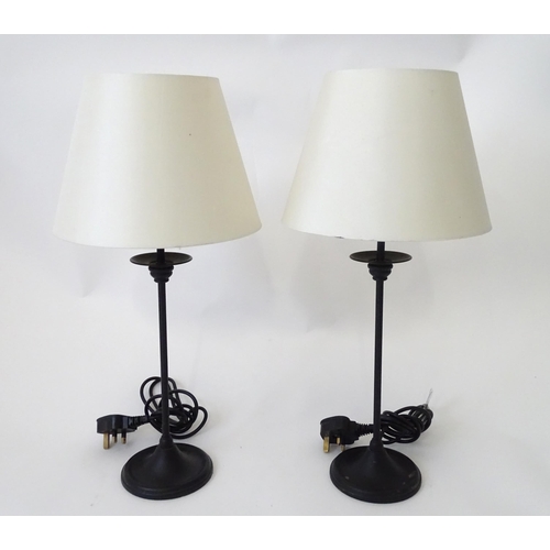 423 - A pair of modern cast metal table lamps in blacked finish, each approx 22