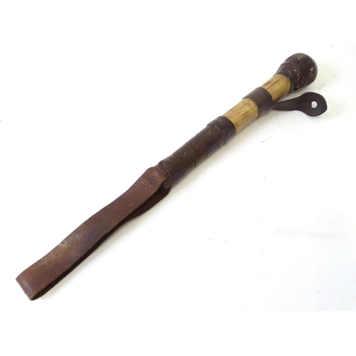 491 - A late 19thC Priest ( dispatching tool ), the mallaca handle with leather wrapping, belt eyelet, str... 