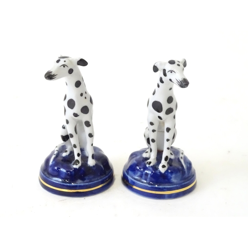 493 - A pair of Staffordshire style models of seated dalmatian dogs. Each approx 4