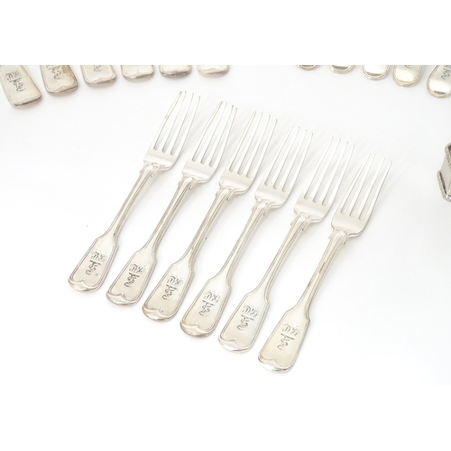 513 - A quantity of assorted silver plate flatware / cutlery by Elkington & Co. Together with a silver nap... 