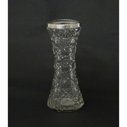 542 - A cut glass vase with silver rim, hallmarked Birmingham c.1901. Approx 7 1/2