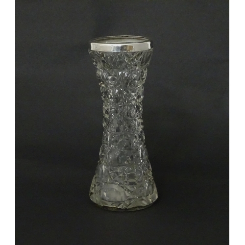 542 - A cut glass vase with silver rim, hallmarked Birmingham c.1901. Approx 7 1/2