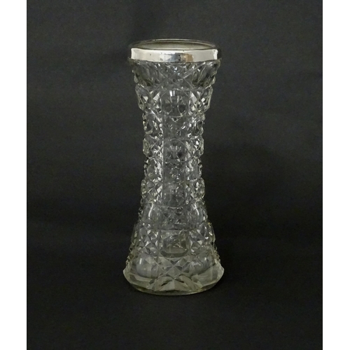 542 - A cut glass vase with silver rim, hallmarked Birmingham c.1901. Approx 7 1/2