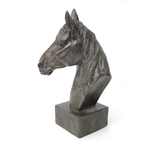 130 - A 20thC cast model of a horse head on a squared plinth. Together with a cast model of a standing hor... 