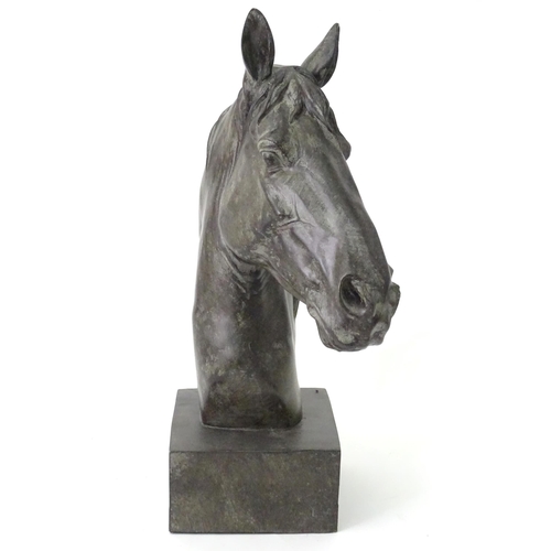 130 - A 20thC cast model of a horse head on a squared plinth. Together with a cast model of a standing hor... 