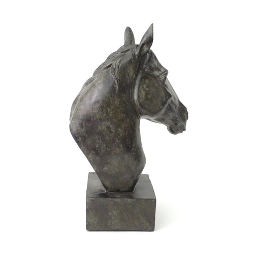 130 - A 20thC cast model of a horse head on a squared plinth. Together with a cast model of a standing hor... 