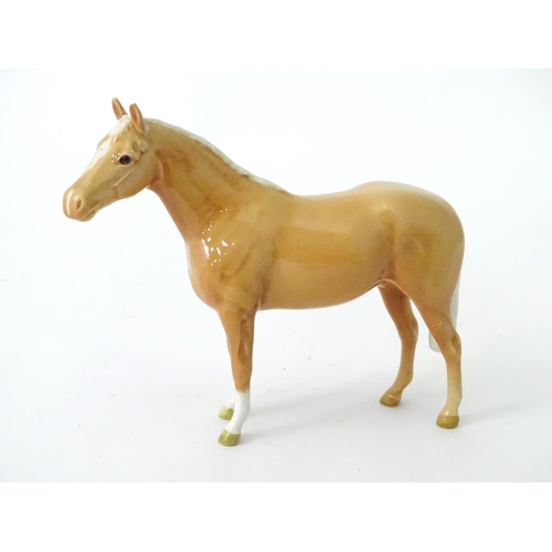 168 - A quantity of assorted Beswick models of horses to include dapple grey, palomino, etc. Together with... 