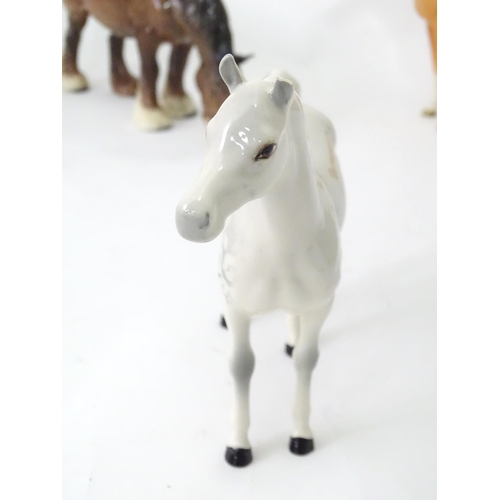 168 - A quantity of assorted Beswick models of horses to include dapple grey, palomino, etc. Together with... 