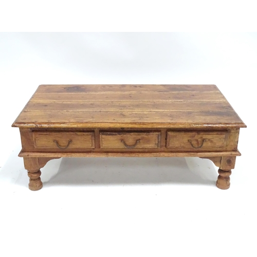 249 - A coffee table with six drawers, approx 43