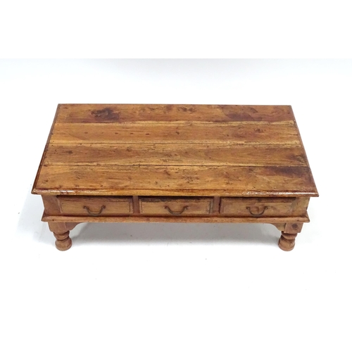 249 - A coffee table with six drawers, approx 43