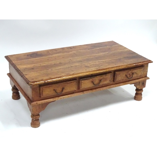 249 - A coffee table with six drawers, approx 43