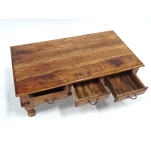 249 - A coffee table with six drawers, approx 43