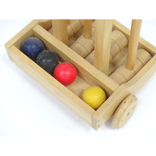 293 - A Croquet set on portable stand, approx 38