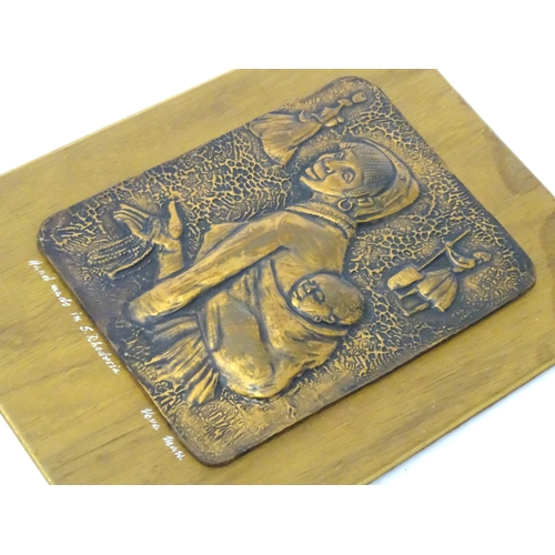 327 - A copper plaque depicting a mother and child. Signed under 'Handmade in S Rhodesia... Vera Maw'. App... 