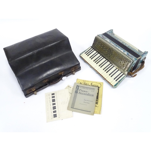 328 - Musical Instrument : a cased mid 20thC Frontalini accordion, with blue pearloid panels, 41 keys and ... 