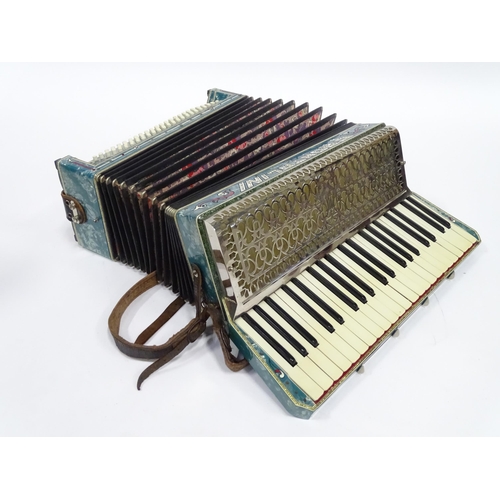 328 - Musical Instrument : a cased mid 20thC Frontalini accordion, with blue pearloid panels, 41 keys and ... 