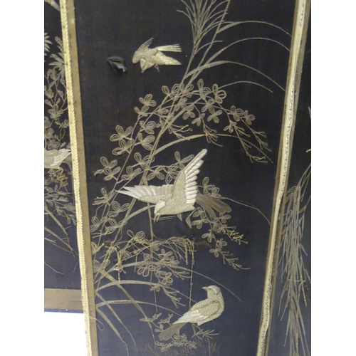 340 - A Japanese four-fold screen, with silkwork panels depicting birds and butterflies amongst foliage, t... 