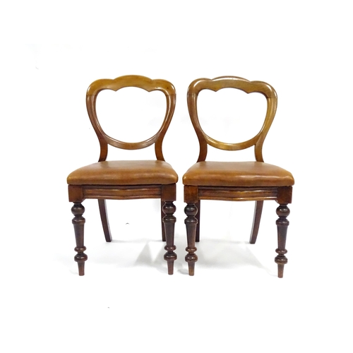 341 - A pair of 19thC mahogany balloon back chairs, the inset seats upholstered with brown leather. Each a... 