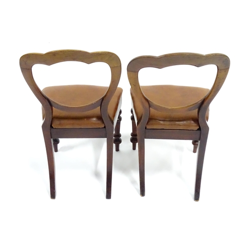 341 - A pair of 19thC mahogany balloon back chairs, the inset seats upholstered with brown leather. Each a... 