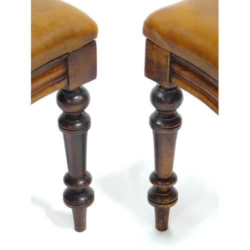 341 - A pair of 19thC mahogany balloon back chairs, the inset seats upholstered with brown leather. Each a... 