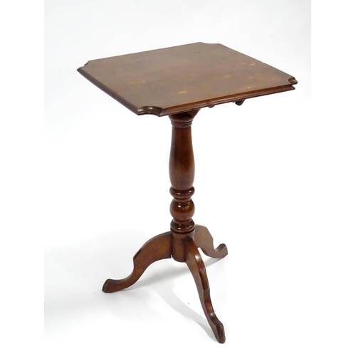 342 - An early 20thC oak tilt-top occasional table, the squared top with chamfered edges and scalloped cor... 