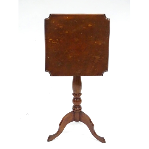 342 - An early 20thC oak tilt-top occasional table, the squared top with chamfered edges and scalloped cor... 