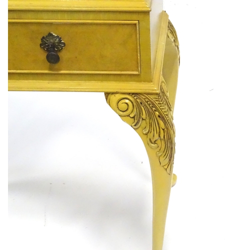 347 - A mid 20thC cocktail cabinet, the exterior with clouded yellow finish and oriental mounts. The upper... 