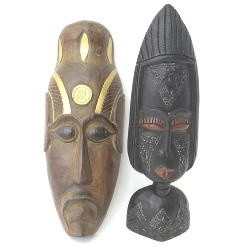 349 - A quantity of assorted carved wooden masks with incised and applied detail. Together with carved mod... 