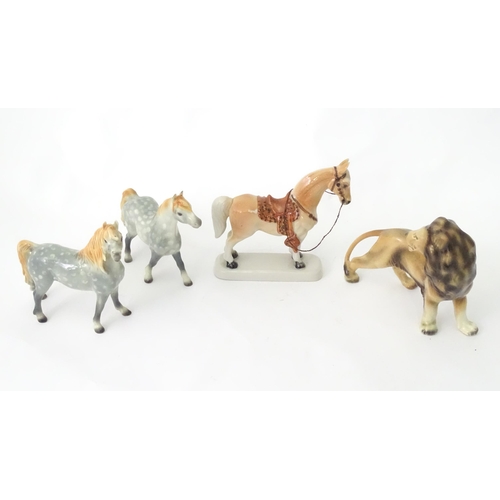 356 - Three West German ceramic model animals comprising horses and lion. Together with a Japanese ceramic... 