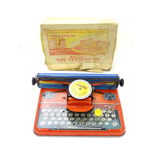 357 - Toy: A Mettoy Junior tinplate toy typewriter with original box.