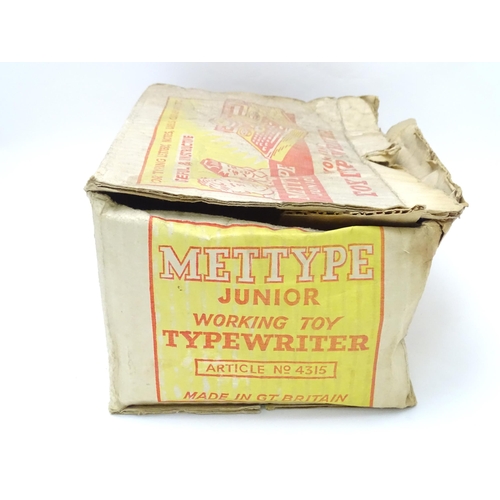 357 - Toy: A Mettoy Junior tinplate toy typewriter with original box.