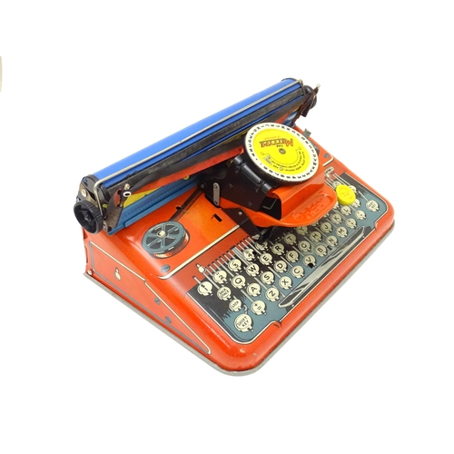 357 - Toy: A Mettoy Junior tinplate toy typewriter with original box.