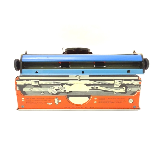 357 - Toy: A Mettoy Junior tinplate toy typewriter with original box.