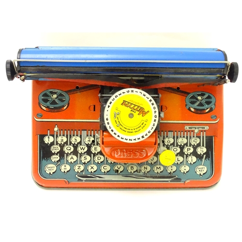 357 - Toy: A Mettoy Junior tinplate toy typewriter with original box.