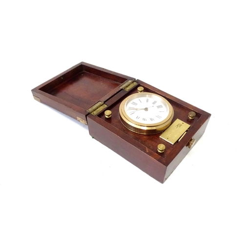 360 - A cased travelling clock with 2 1/4