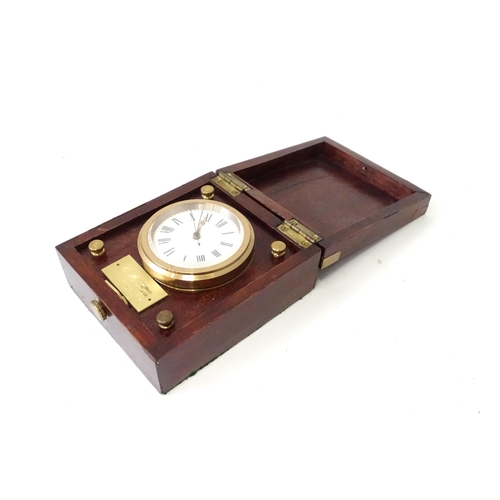 360 - A cased travelling clock with 2 1/4