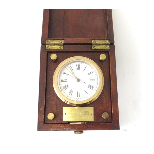 360 - A cased travelling clock with 2 1/4