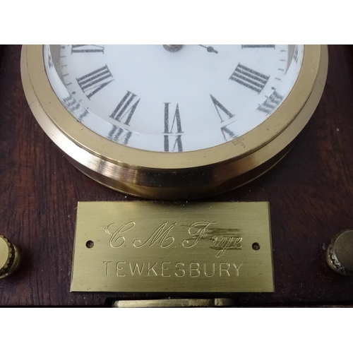 360 - A cased travelling clock with 2 1/4