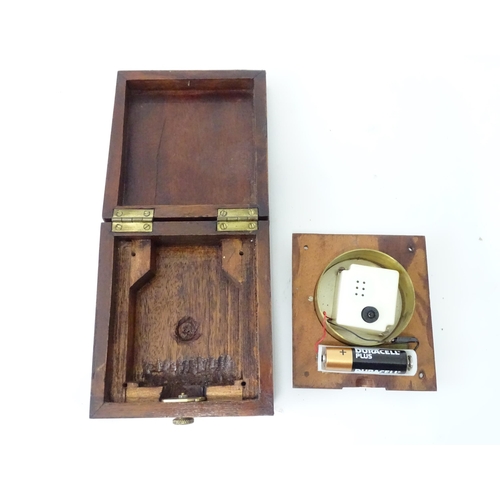 360 - A cased travelling clock with 2 1/4