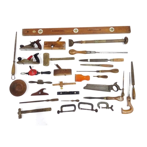 381 - A quantity of carpentry / woodworking tools , including jack planes, saws, hammer, a rebate plane by... 