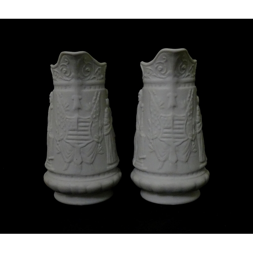 459 - Three Portmeirion Parian ware jugs with relief detail. Largest approx. 4 1/2