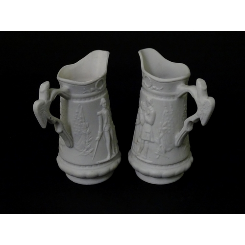 459 - Three Portmeirion Parian ware jugs with relief detail. Largest approx. 4 1/2