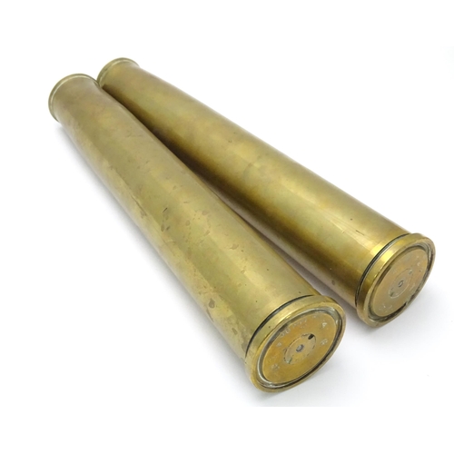 461 - Two brass 40mm Bofors cannon shell cases, each bearing Ministry of Defence forward arrow marks and d... 